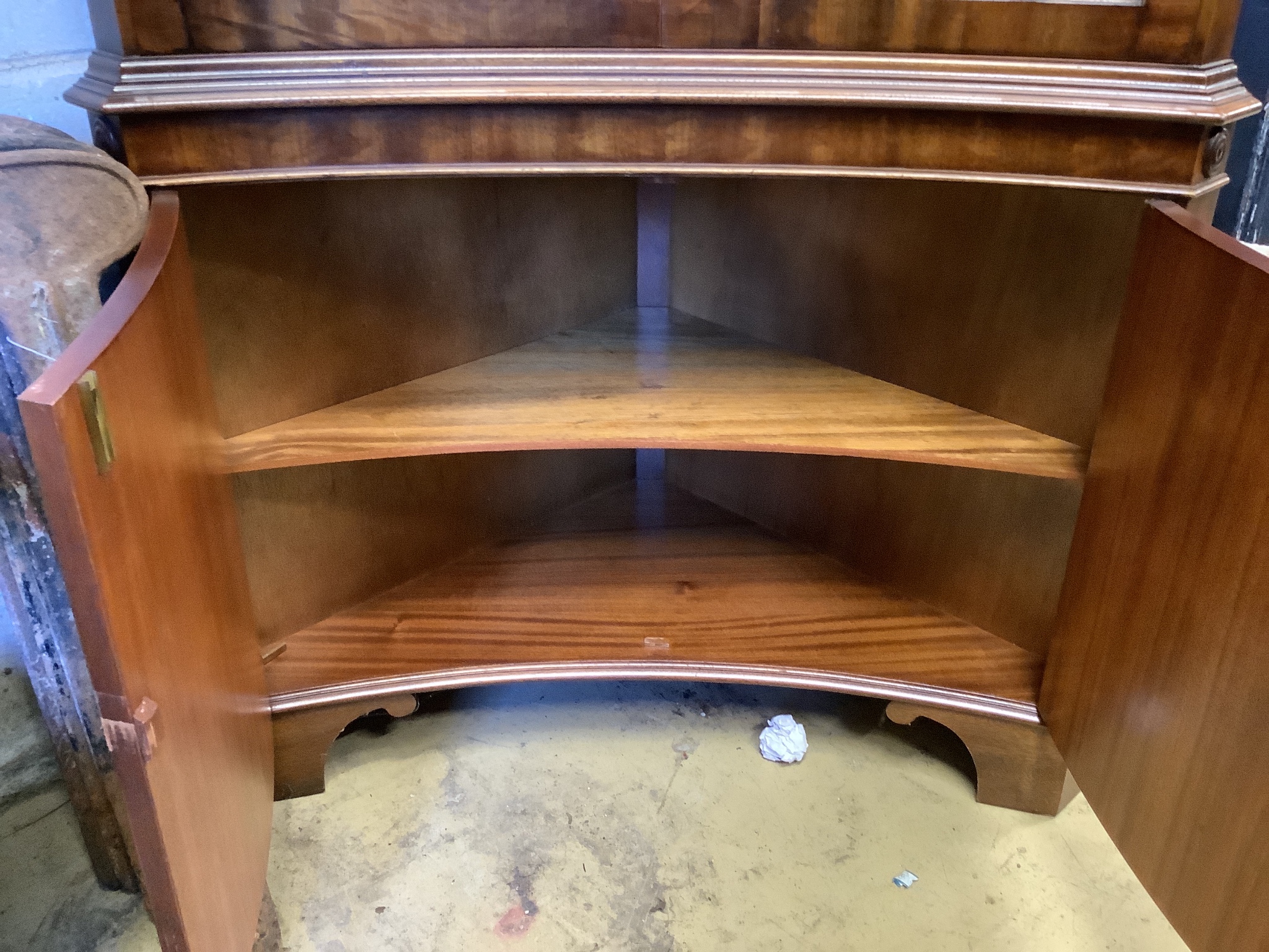 A Georgian style mahogany floor-standing corner display cabinet